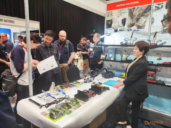 Ningbo Zhongdi representatives showcasing electronic components and soldering equipment at the Australian supplier conference.