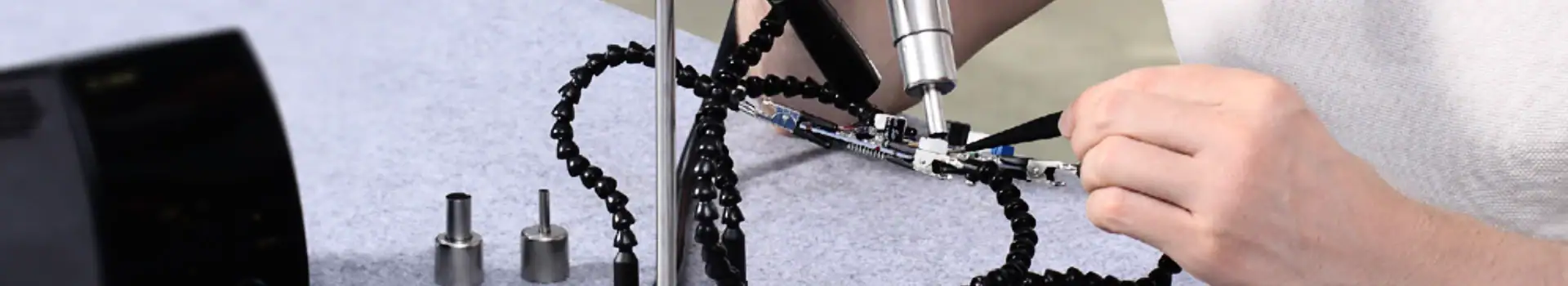 Robotic arm performing precise assembly in a manufacturing setting, showcasing advanced automation technology.