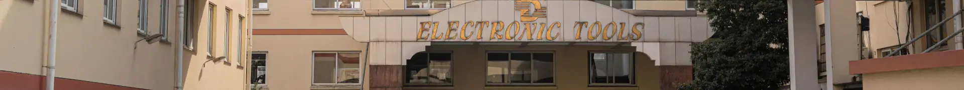 Electronic tools store sign on building exterior, showcasing a retail shop specializing in power tools and hardware supplies.
