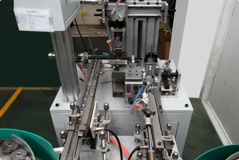 Industrial automation machinery with mechanical parts and electrical wiring used in manufacturing processes.