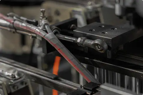 Precision industrial machinery with metal components and hydraulic systems for manufacturing processes.