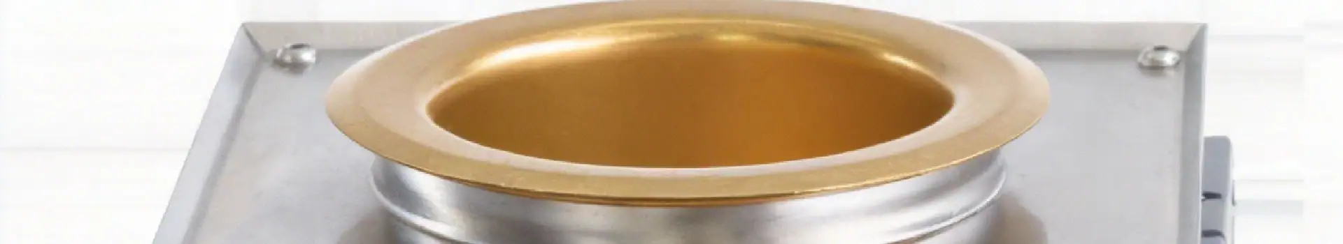 An image showcasing a gold plating machine used for electroplating jewelry and decorative items. The process involves applying a thin layer of gold onto a substrate to enhance appearance and durabilit.