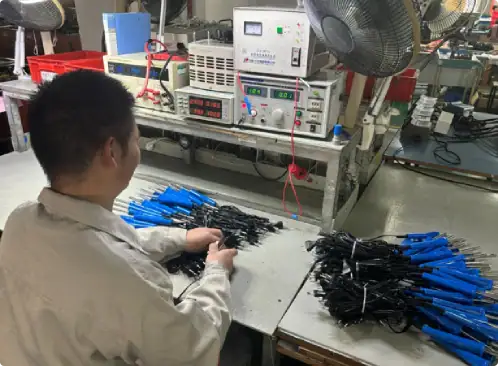 Electronic testing and assembly process in a factory setting.