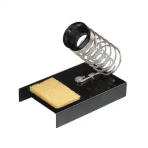 Cleaning sponge and metal spring in a black tray for cleaning purposes.