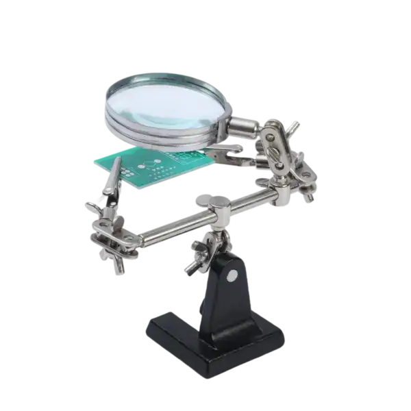 Magnifying glass with adjustable arm for detailed electronic soldering work.