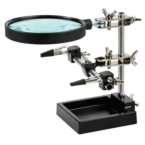 Magnifying soldering station for precise electronic work with adjustable magnifier and multiple tool holders. Ideal for detailed soldering tasks and electronics repair.