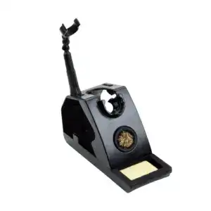 Cannabis concentrate vaporizer with dab tool and heating chamber for concentrates. Compact black device for dabbing and vaporizing cannabis extracts.