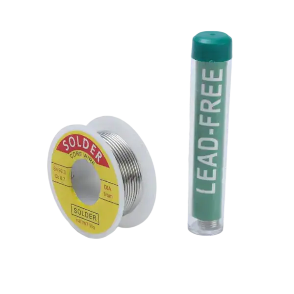 Close-up of soldering wire spool and lead-free solder paste tube, essential tools for electronic soldering and circuit assembly.