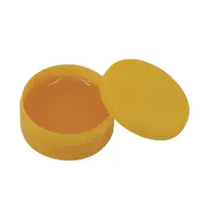 Yellow container of rosin soldering flux with lid open, used for improving solder adhesion in electronics repair and assembly.