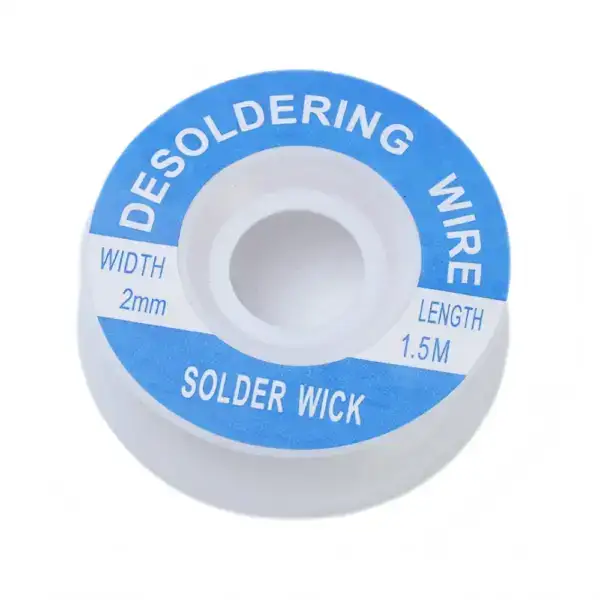 Close-up of solder wick spool used for removing excess solder during electronic circuit repairs.
