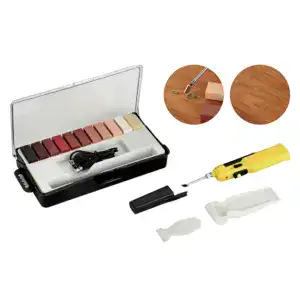 Portable plastic welding kit with heat gun, color sticks, and accessories for repairing plastic surfaces and cracks.