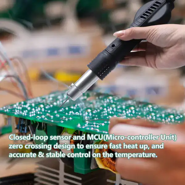 Close-up of a hot air rework station used for soldering and desoldering electronic components on a circuit board. The device features a handheld hot air gun aimed at a green PCB with electronic compon.