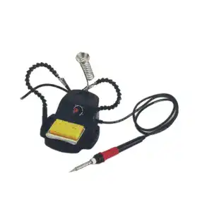 Soldering station with adjustable temperature control, soldering iron, and cleaning sponge for electronics repair and soldering projects.