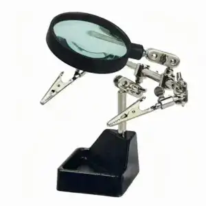 Magnifying glass and adjustable clips for precise soldering work.